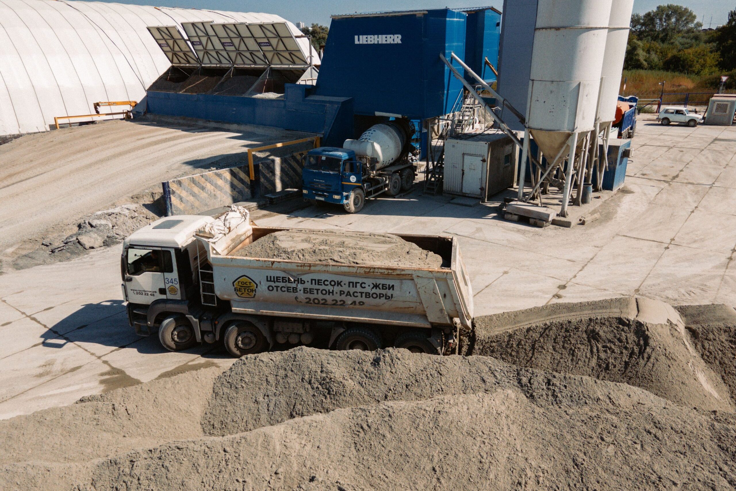 Aerial view of a concrete batching plant with dump truck in Novosibirsk, Russia.